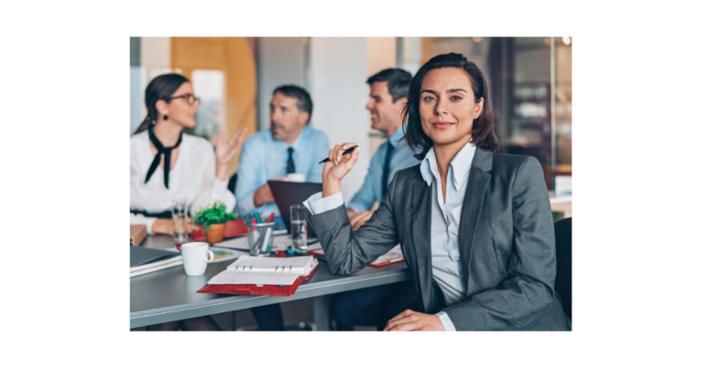 Leadership coach in office with her team