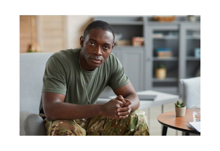 Military Man sat in office