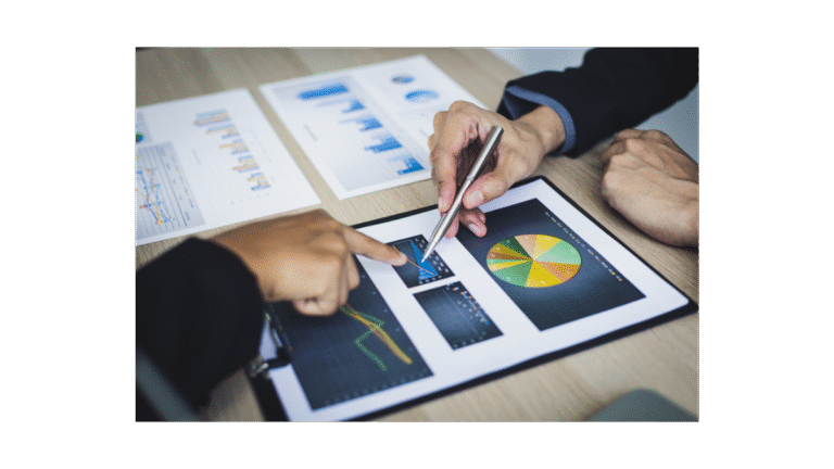 Two people looking at their financial and opperational charts