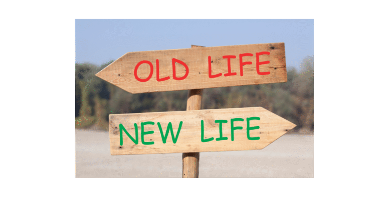 A Life coach sign post with old life and new life written on it