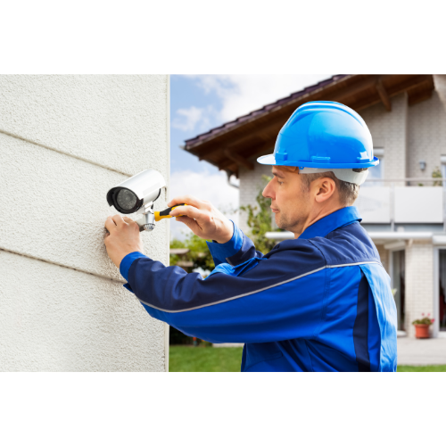 Man fitting a security camera