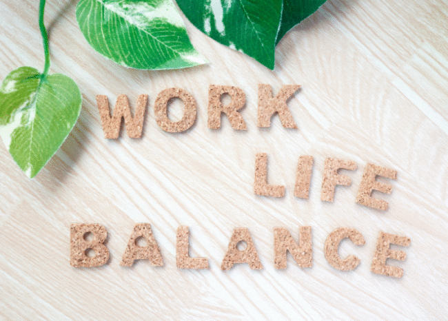 A picture of Work Life Balance written is Sand