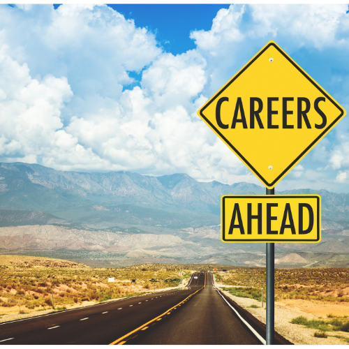 Diamond sign post with careers ahead on a road